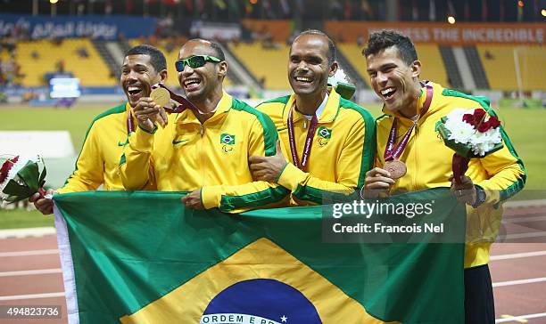 Felipe Gomes of Brazil poses with his gold medal and Daniel Silva of Brazil bronze for the men's 200m T11 final during the Evening Session on Day...