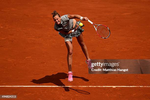 Petra Kvitova of Czech Republic serves during her women's singles match against Svetlana Kuznetsova of Russia on day seven of the French Open at...