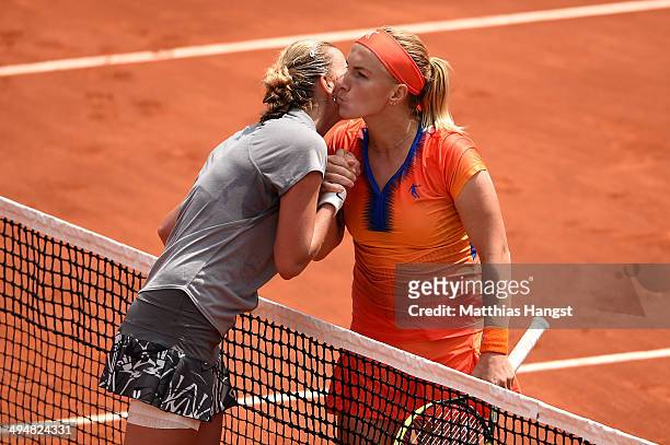 Svetlana Kuznetsova of Russia kisses Petra Kvitova of Czech Republic at the net following her victory in their women's singles match on day seven of...