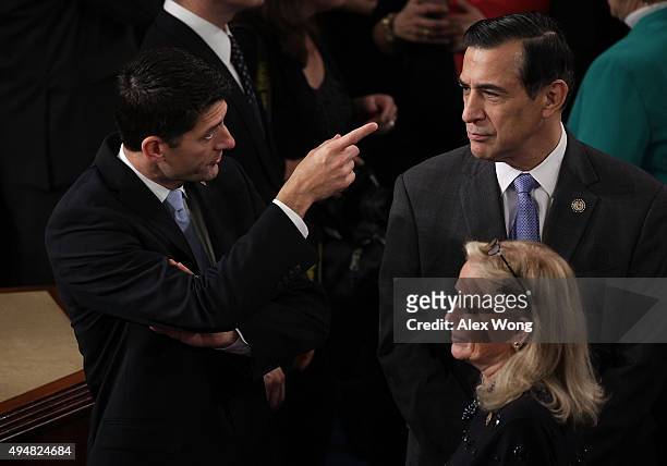 Rep. Paul Ryan talks with Rep. Darrell Issa as Rep. Debbie Dingell looks on in the House Chamber of the Capitol October 29, 2015 on Capitol Hill in...