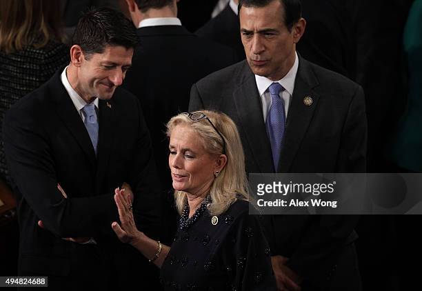 Rep. Paul Ryan shares a moment with Rep. Darrell Issa and Rep. Debbie Dingell in the House Chamber of the Capitol October 29, 2015 on Capitol Hill in...