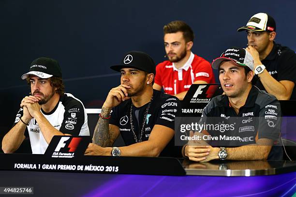 Fernando Alonso of Spain and McLaren Honda, Lewis Hamilton of Great Britain and Mercedes GP and Sergio Perez of Mexico and Force India, Will Stevens...