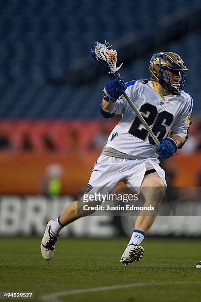 John Haus of the Charlotte Hounds in action against Domenic Sebastiani the Denver Outlaws at Sports Authority Field at Mile High on May 30, 2014 in...