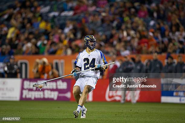 Ryan Flanagan of the Charlotte Hounds in action against the Denver Outlaws at Sports Authority Field at Mile High on May 30, 2014 in Denver,...