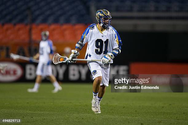 Joe Cummings of the Charlotte Hounds in action against the Denver Outlaws at Sports Authority Field at Mile High on May 30, 2014 in Denver, Colorado....