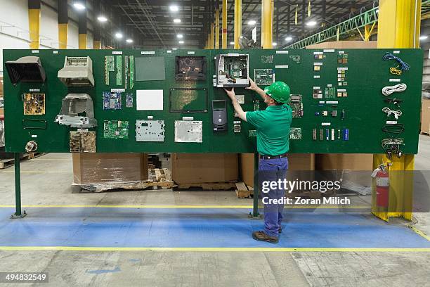 Board with all awaiting to be dismantled computer parts as recyclable waste at the Electronic Recyclers International plant in Holliston,...