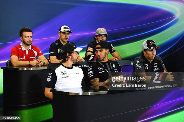 Fernando Alonso of Spain and McLaren Honda, Lewis Hamilton of Great Britain and Mercedes GP and Sergio Perez of Mexico and Force India, Will Stevens...