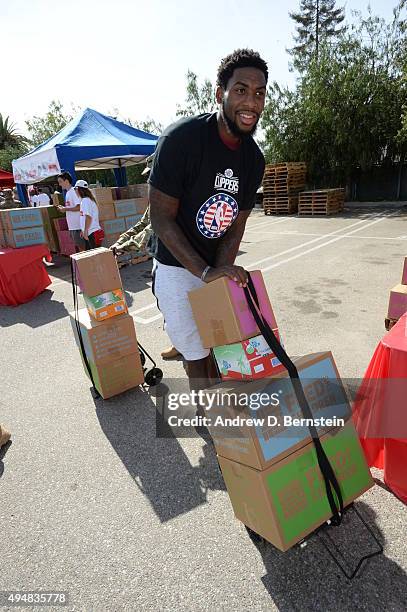 Branden Dawson of the Los Angeles Clippers participates in Feed The Community event at the Salvation Army Siemon Family Youth and Community Center in...