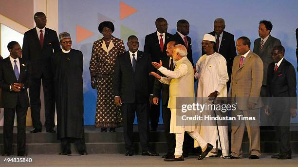 Prime Minister Narendra Modi on stage with African Heads of State and leaders as they pose for a group photograph during the India-Africa Forum...