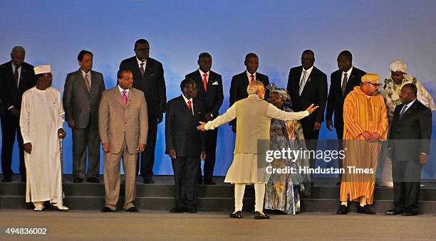 Prime Minister Narendra Modi on stage with African Heads of State and leaders as they pose for a group photograph during the India-Africa Forum...