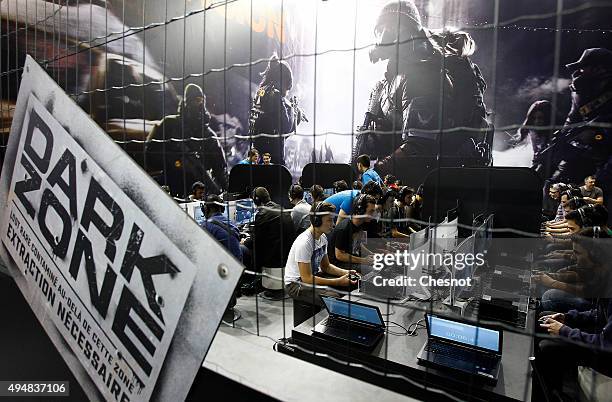 Gamers play the video game "Tom Clancy's The Division" developed by Ubisoft at Paris Games Week, a trade fair for video games on October 29, 2015 in...