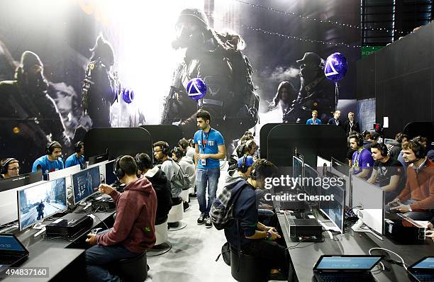 Gamers play the video game "Tom Clancy's The Division" developed by Ubisoft at Paris Games Week, a trade fair for video games on October 29, 2015 in...