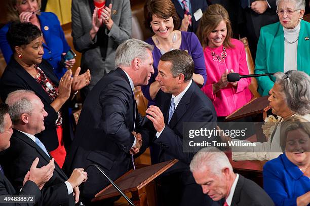 Outgoing Speaker John Boehner, R-Ohio, right, greets House Majority Leader Kevin McCarthy, R-Calif., before Rep. Paul Ryan, R-Wisc., was sworn in on...