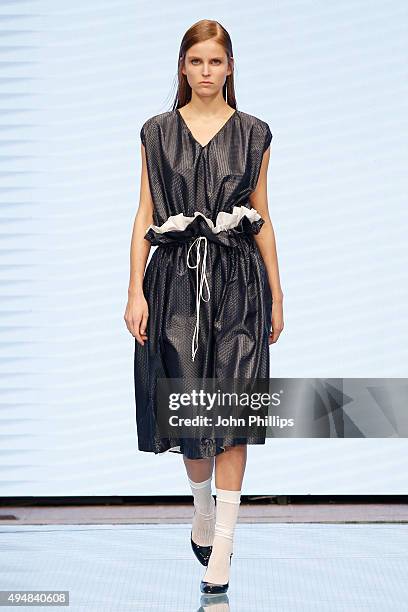 Model walks the runway at the Arthur Arbesser show as part of the Talents Fashion show during the Vogue Fashion Dubai Experience 2015 at The Dubai...