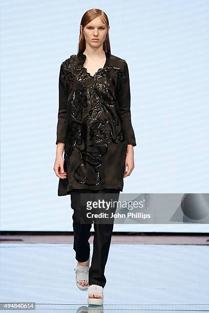 Model walks the runway at the Xiao Li show as part of the Talents Fashion show during the Vogue Fashion Dubai Experience 2015 at The Dubai Mall on...