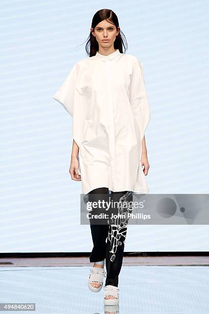 Model walks the runway at the Xiao Li show as part of the Talents Fashion show during the Vogue Fashion Dubai Experience 2015 at The Dubai Mall on...