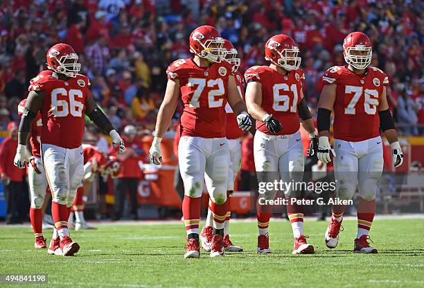 Offensive linemen Laurent Duvernay-Tardif, Mitch Morse, Eric Fisher and Ben Grubbs of the Kansas City Chiefs walk out onto the field against the...