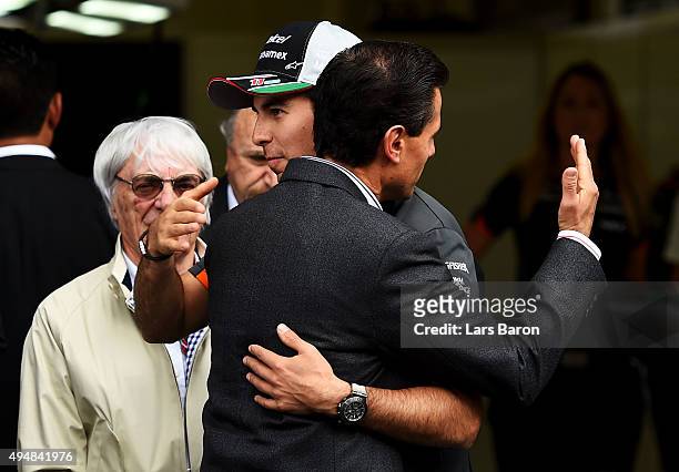 Sergio Perez of Mexico and Force India greets the President of Mexico, Enrique Pena Nieto next to F1 supremo Bernie Ecclestone outside the Force...