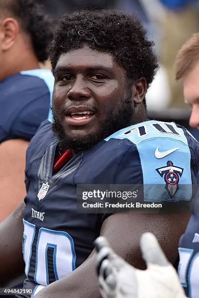 Chance Warmack of the Tennessee Titans watches from the sideline during a game against the Atlanta Falcons at Nissan Stadium on October 25, 2015 in...