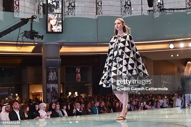 Model walks the runway at the Talents Fashion show during the Vogue Fashion Dubai Experience 2015 at The Dubai Mall on October 29, 2015 in Dubai,...