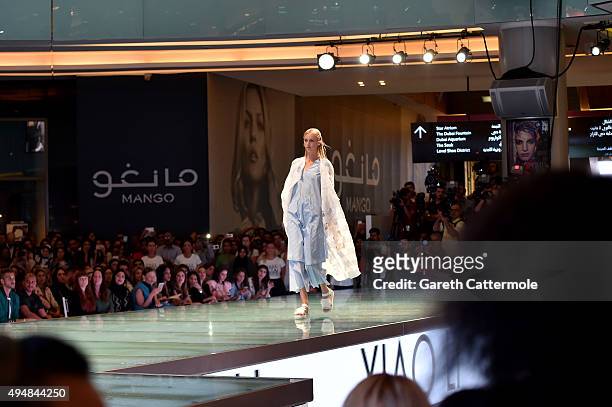 Model walks the runway at the Talents Fashion show during the Vogue Fashion Dubai Experience 2015 at The Dubai Mall on October 29, 2015 in Dubai,...