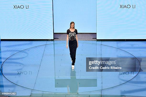 Model walks the runway at the Talents Fashion show during the Vogue Fashion Dubai Experience 2015 at The Dubai Mall on October 29, 2015 in Dubai,...