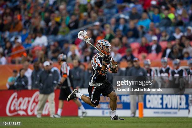 Cameron Flint of the Denver Outlaws in action against the Charlotte Hounds at Sports Authority Field at Mile High on May 30, 2014 in Denver,...