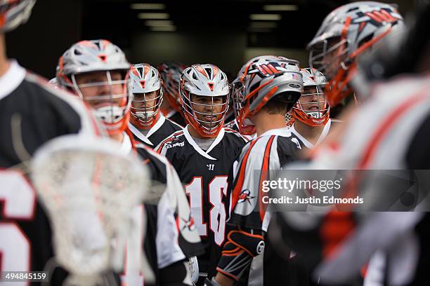 Cameron Flint of the Denver Outlaws prepares to take the field with his team before a game against the Charlotte Hounds at Sports Authority Field at...