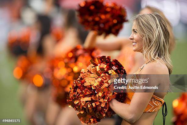 The Denver Outlaws dancers pump up the crowd before a game against the Charlotte Hounds at Sports Authority Field at Mile High on May 30, 2014 in...