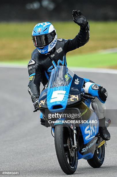Racing's Moto3 Italian rider Romano Fenati waves to supporters at the end of the qualifying session of the motorcycling Italian Grand Prix on...