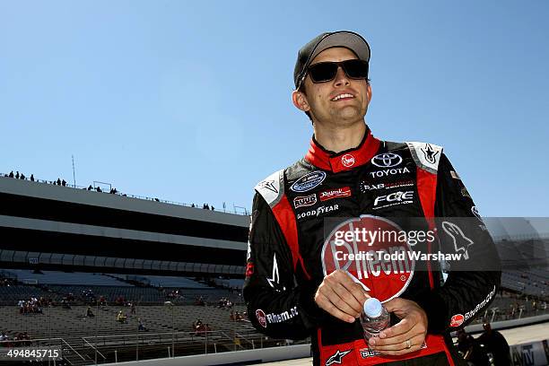 James Buescher, driver of the Rheem Toyota, looks on during qualifying for the NASCAR Nationwide Series Buckle Up 200 Presented By Click It Or Ticket...