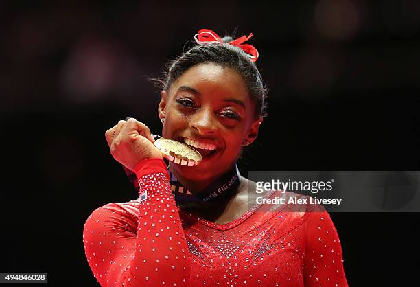 Simone Biles of USA poses with the Gold medal after winning the All-Around Final on day seven of the 2015 World Artistic Gymnastics Championships at...