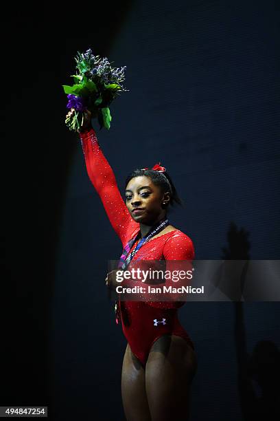 Simone Biles of United States poses with her Gold medal during day seven of World Artistic Gymnastics Championships at The SSE Hydro on October 29,...