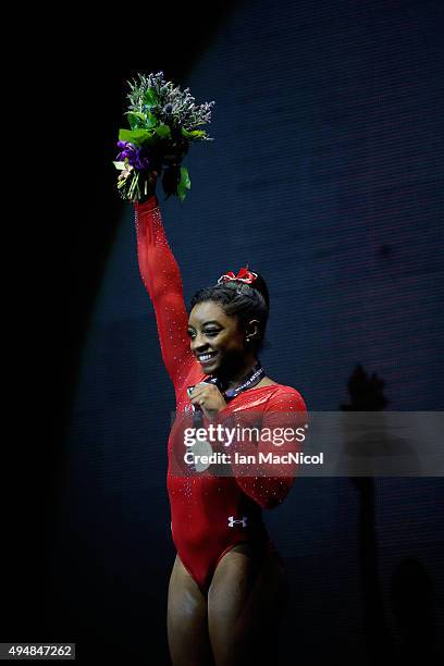 Simone Biles of United States poses with her Gold medal during day seven of World Artistic Gymnastics Championships at The SSE Hydro on October 29,...