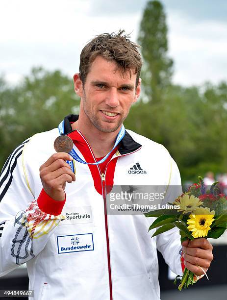 Jan Benzien of Germany poses with his bronze medallist after the medal ceremony of the Canoe Single Men during the European Canoe Slalom...