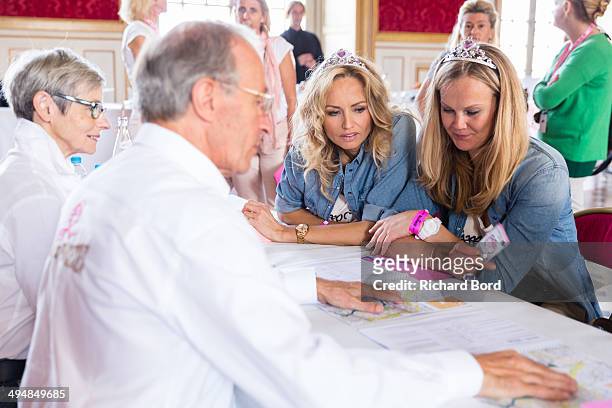 Adriana Karembeu and her sister Natalia Sklenarikova are seen at the registration desk in Les Invalides as they take part in the 15th Rallye des...