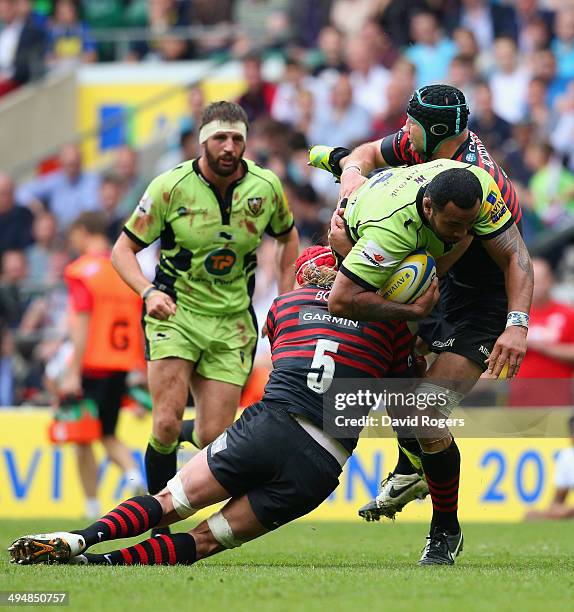 Mouritz Botha and Steve Borthwick of Saracens up end Samu Manoa of Northampton Saints during the Aviva Premiership Final between Saracens and...