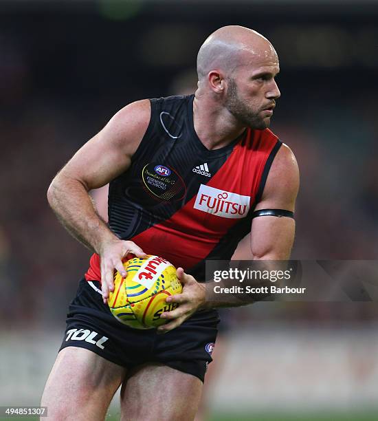 Paul Chapman of the Bombers runs with the ball during the round 11 AFL match between the Essendon Bombers and the Richmond Tigers at the Melbourne...