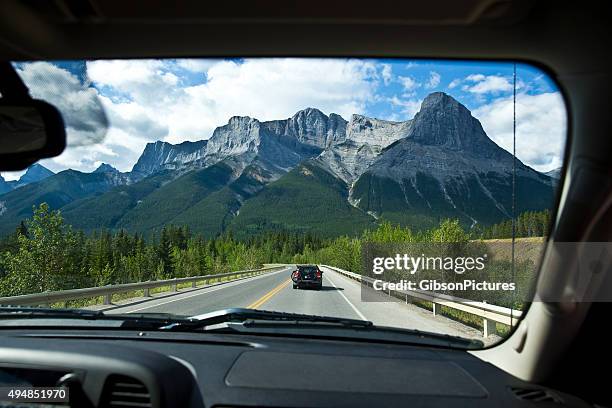 rocky mountain road trip - car back view bildbanksfoton och bilder