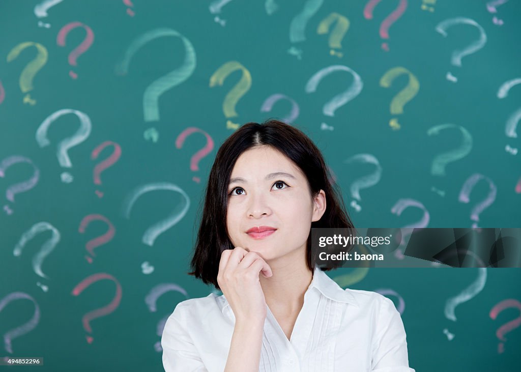 Young woman with question mark