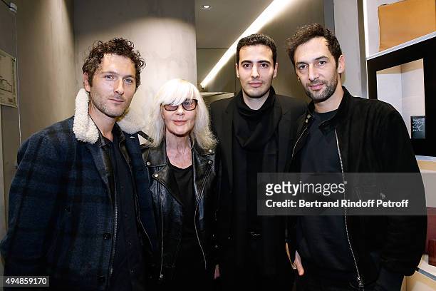 Betty Catroux and Co-Founder of the Store, Jean-Victor Meyers standing between Members of Musical Group Aaron, Olivier Coursier and Simon Buret...