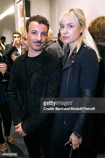 Calligrapher Nicolas Ouchenir and Anne-Sophie Mignaux attend the Opening of the Collection 'Exemplaire x Nicolas Ouchenir' at Exemplaire Store on...