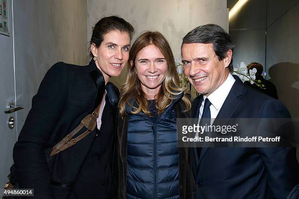 Sophie Agon standing between Marc Menesguen and his wife Vanessa attend the Opening of the Collection 'Exemplaire x Nicolas Ouchenir' at Exemplaire...