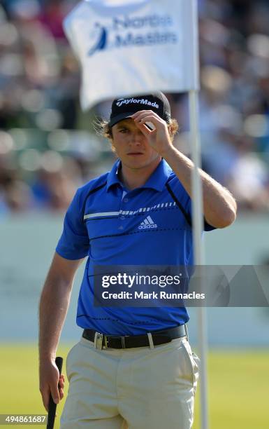 Eddie Pepperell of England acknowledges the applause from the gallery around the 18th green during the Nordea Masters at the PGA Sweden National on...