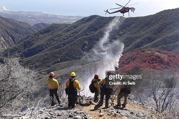 2442925_me_1030_gibraltar_fire_ALS Firefighters from various agencies continue to make their way to contain a brush fire that has broken out in the...