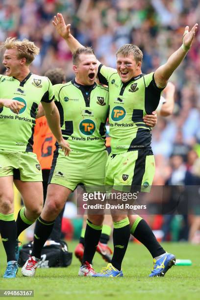 Tom Stephenson Alex Waller and Dylan Hartley of Northampton Saints celebrate victory during the Aviva Premiership Final between Saracens and...