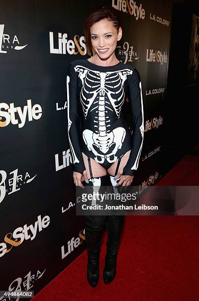 Singer Jessica Sutta attends Life & Style Weekly's "Eye Candy" Halloween Bash hosted by LeAnn Rimes at Riviera 31 at Sofitel on October 29, 2015 in...