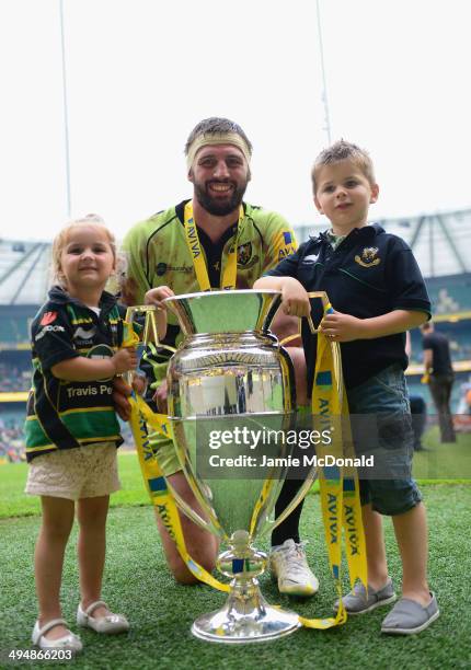 Captain Tom Wood of Northampton Saints and children pose with the Aviva Premiership trophy during the Aviva Premiership Final between Saracens and...