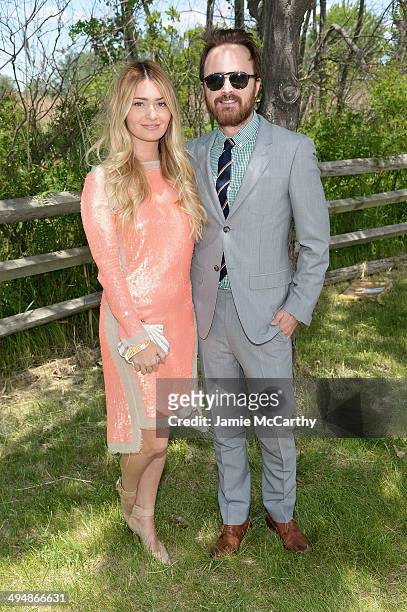Lauren Parsekian and Aaron Paul attend the seventh annual Veuve Clicquot Polo Classic in Liberty State Park on May 31, 2014 in Jersey City City.