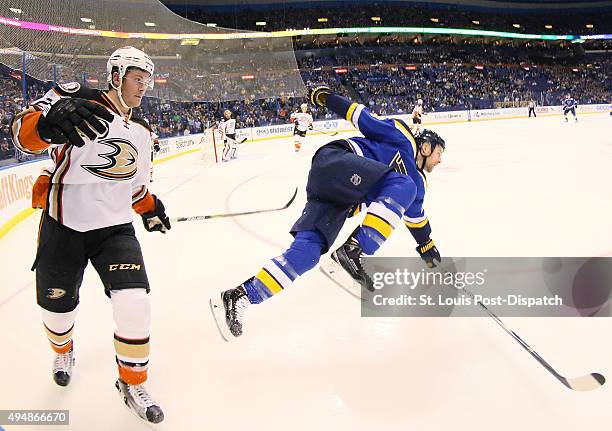 The St. Louis Blues' Kyle Brodziak, right, loses his footing as he pursues the puck against the Anaheim Ducks' Chris Wagner in the first period on...